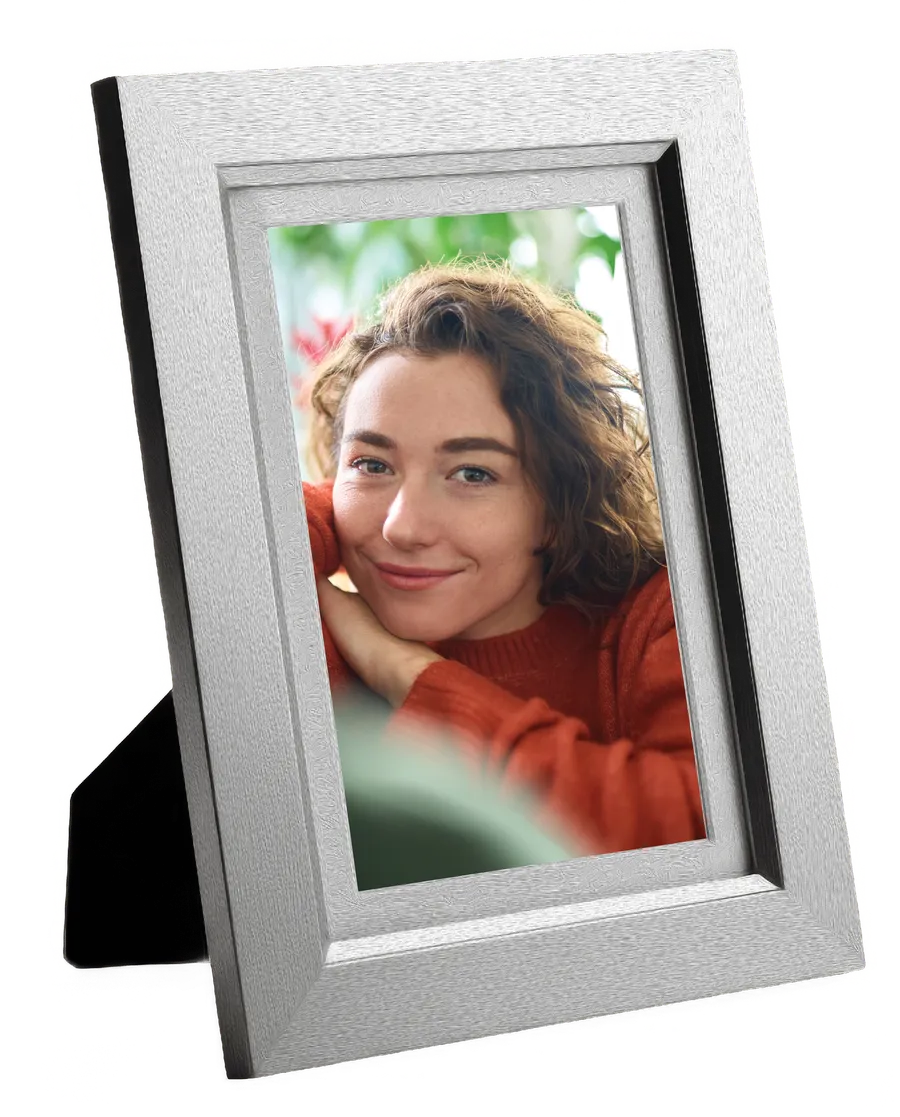 A framed photograph, standing