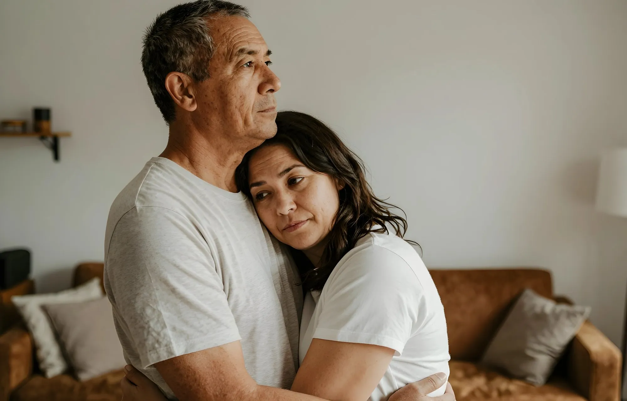 An older man comforting a younger woman